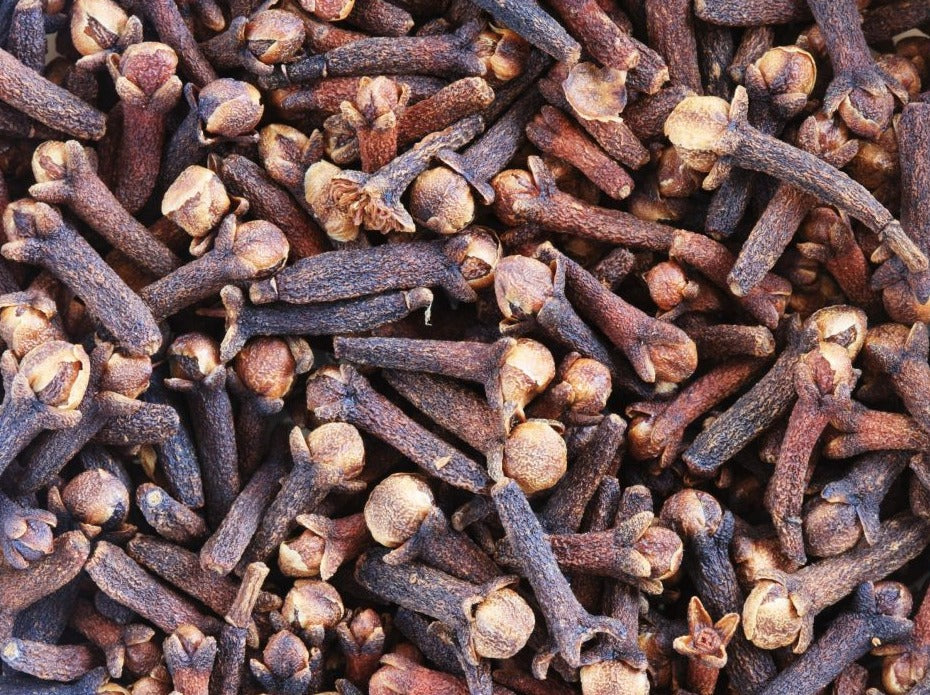 Clove bud an aromatic flower usually with clove leaves on them.
