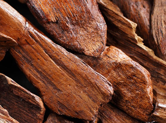 Sandalwood cut into many pieces to show off its interesting texture.